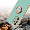 A phone case with a ring holder and camera protection is shown on a cracked, rocky surface with fallen leaves. Náhľad obrázku produktu