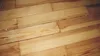 A close-up view of wooden floorboards. Produktbild-Vorschau