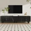A black TV stand with a TV mounted above it in a modern living room setting. Voir les images du produit
