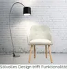 A beige armchair is placed in front of a white brick wall, with a black floor lamp to its left. Produktbild-Vorschau
