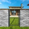 A garden gate in front of a brick wall and a house. Produktbild-Vorschau