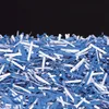 A pile of shredded blue and white paper against a black background. Podgląd zdjęcia produktu