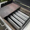 A close-up view of the interior of a grill, showing new stainless steel heat shields and a cast iron grill grate. Podgląd zdjęcia produktu