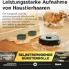 A robot vacuum cleaner is shown on a wooden floor with pet hair and two pet bowls. A dog is visible in the background. Produktbild-Vorschau