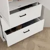 Close-up view of two open drawers of a white cabinet, showing jars and containers inside. Anteprima dell’immagine prodotto