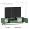 A green TV lowboard with a television on top, showing its features. Podgląd zdjęcia produktu