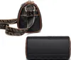 Two views of a black leather handbag with a checkered pattern and brown trim. Podgląd zdjęcia produktu