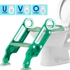 A green and white child's toilet training seat with a ladder attached to a toilet. Produktbild-Vorschau
