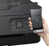 A hand holding a smartphone is scanning a QR code on a printer. Produktbild-Vorschau