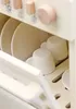 A close-up view of a toy dishwasher filled with toy dishes and cups. Náhľad obrázku produktu