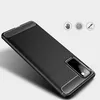 A black phone case with a carbon fiber texture is shown at an angle against a white background. Podgląd zdjęcia produktu