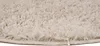 A close-up view of the texture and edge of a round rug. Anteprima dell’immagine prodotto