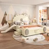 A child's bedroom with a bed featuring a slide and stairs, decorated with a mountain and hot air balloon mural. Produktbild-Vorschau