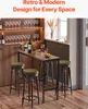 A bar table with stools in a home bar setting, with wine glasses and bottles displayed. Produktbild-Vorschau