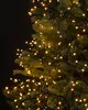 A close-up view of warm white LED lights on a Christmas tree. Podgląd zdjęcia produktu