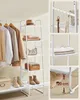 A white shelving unit displaying clothing, shoes, and accessories. Náhled obrázku produktu