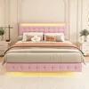 A pink upholstered bed with LED lighting in a bedroom setting. Podgląd zdjęcia produktu