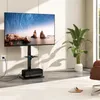 A modern living room with a TV stand and a large plant. Podgląd zdjęcia produktu