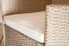 A close-up view of a cushion on a wicker chair. Náhled obrázku produktu