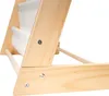 Close-up view of the wooden structure of a children's organizer with white fabric shelves. Anteprima dell’immagine prodotto