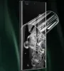 A screen protector is shown being applied to a smartphone, with water droplets and bubbles visible. Produktbild-Vorschau