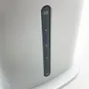 A close-up shot of a water level indicator on a white appliance. Produktbild-Vorschau