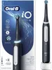 The image shows the packaging and the electric toothbrush itself, along with its charging base. Produktbild-Vorschau