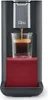 A Tchibo Qbo coffee machine is brewing espresso into a glass cup. Produktbild-Vorschau