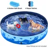 Three dogs playing in a blue inflatable pool. Produktbild-Vorschau