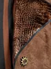 A close-up view of a garment with textured fabric and a decorative button. Produktbild-Vorschau