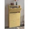 A light wood shoe cabinet with two drawers and a flip-down compartment, placed against a light gray wall. Podgląd zdjęcia produktu