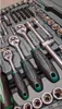A close-up view of a tool kit, showcasing various sockets and ratchets. Produktbild-Vorschau