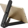 A black tablet stand holding a gold tablet. Náhľad obrázku produktu