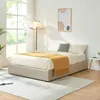 A bedroom scene with a bed, lamp, and artwork. Produktbild-Vorschau