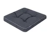 A dark gray tufted cushion with a light gray trim, shown from a slightly elevated angle on a white background. Podgląd zdjęcia produktu