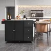 A black kitchen island cart with a white countertop is shown in a modern kitchen setting. There are bottles of wine, fruit, and a kettle on the countertop. A chair is visible to the right. Produktbild-Vorschau