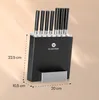 A black knife block with seven knives inserted, with dimensions indicated by dashed lines and text. Náhľad obrázku produktu