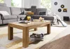A living room scene with a sectional sofa, coffee table, and decorative items. Produktbild-Vorschau