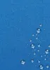A close-up of a blue fabric with water droplets on it. Náhľad obrázku produktu