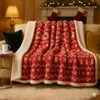 A cozy living room scene with a red and white Christmas-themed blanket draped over a sofa, with a fireplace and stockings in the background. Náhled obrázku produktu