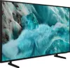 A side view of a black Samsung QLED television displaying a vibrant, abstract image. Náhľad obrázku produktu