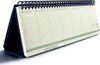 A desk calendar is shown against a white background. Podgląd zdjęcia produktu