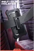 A black belt-clip holster is shown attached to a grey belt, with a blurred background suggesting a futuristic or industrial setting. Produktbild-Vorschau