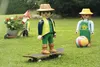 Three Playmobil figures and a ball are in a garden setting. Náhľad obrázku produktu