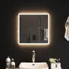 A modern bathroom scene featuring a square LED mirror above a sink with a chrome faucet. Bottles of soap and a toothbrush holder are on the counter. Anteprima dell’immagine prodotto