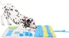 A Dalmatian dog is playing with a snuffle mat. Produktbild-Vorschau