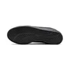 The bottom view of a black Puma sneaker. Produktbild-Vorschau