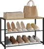 A two-tier shoe rack filled with various shoes and a handbag and a basket on the top shelf. Produktbild-Vorschau