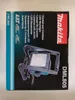 The image shows the packaging of a Makita LED worklight. Podgląd zdjęcia produktu