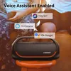 Two people sitting outdoors with a Tronsmart speaker. Náhľad obrázku produktu